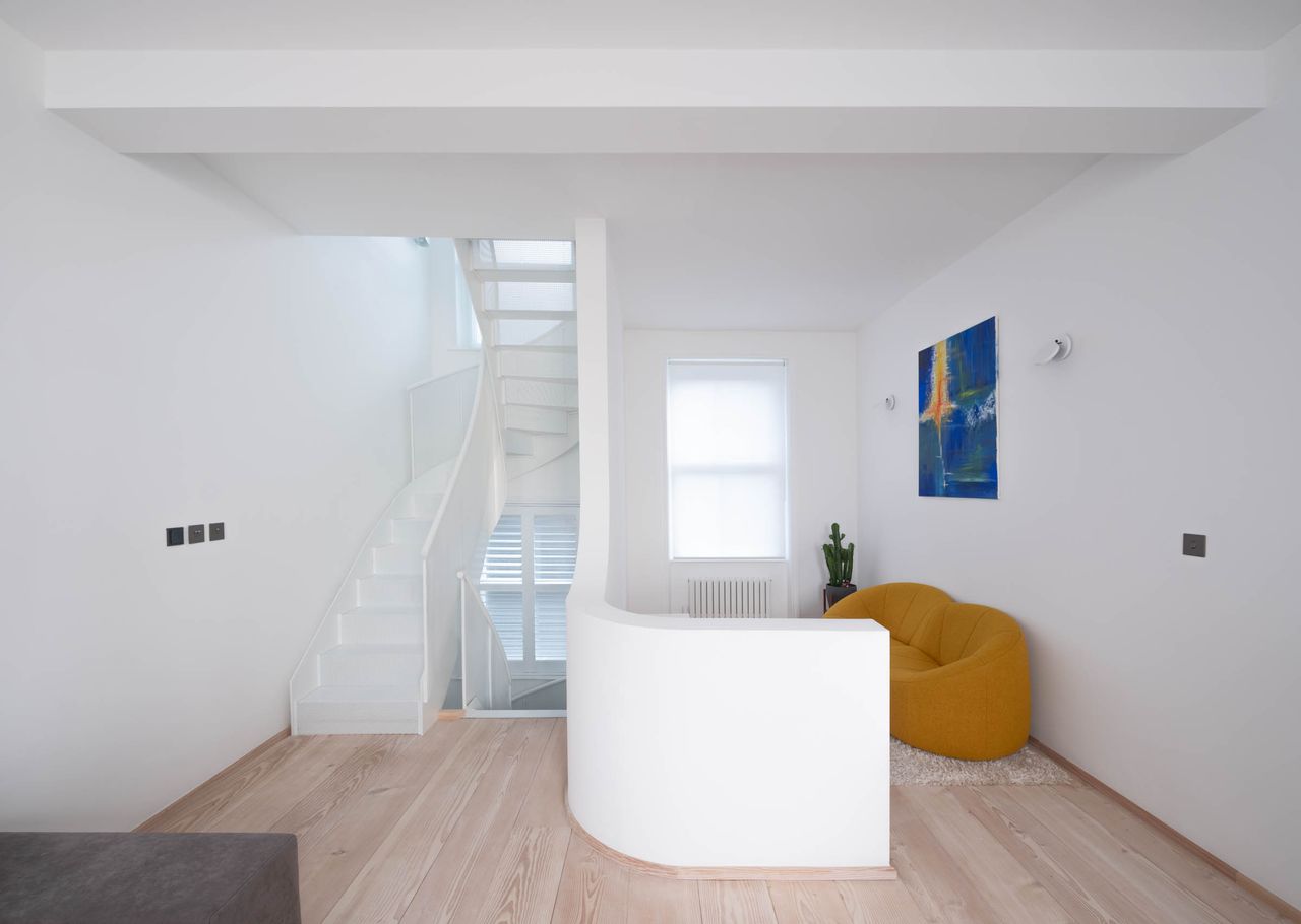 white minimalist interior by architensions with redesigned staircase