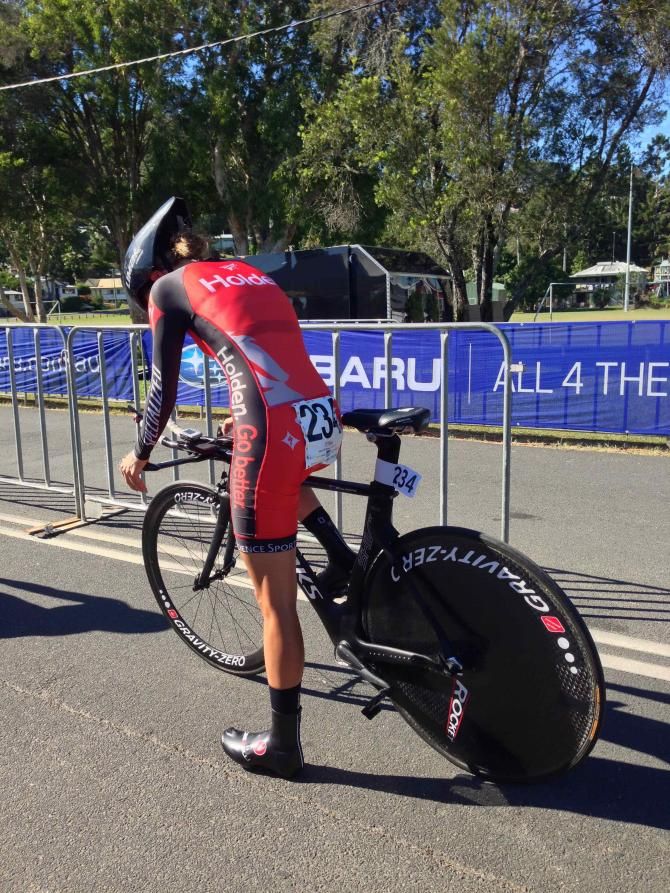Griffiths (Holden) checks her front brake is aligned