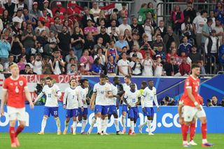 France's players celebrate a narrow win over Austria