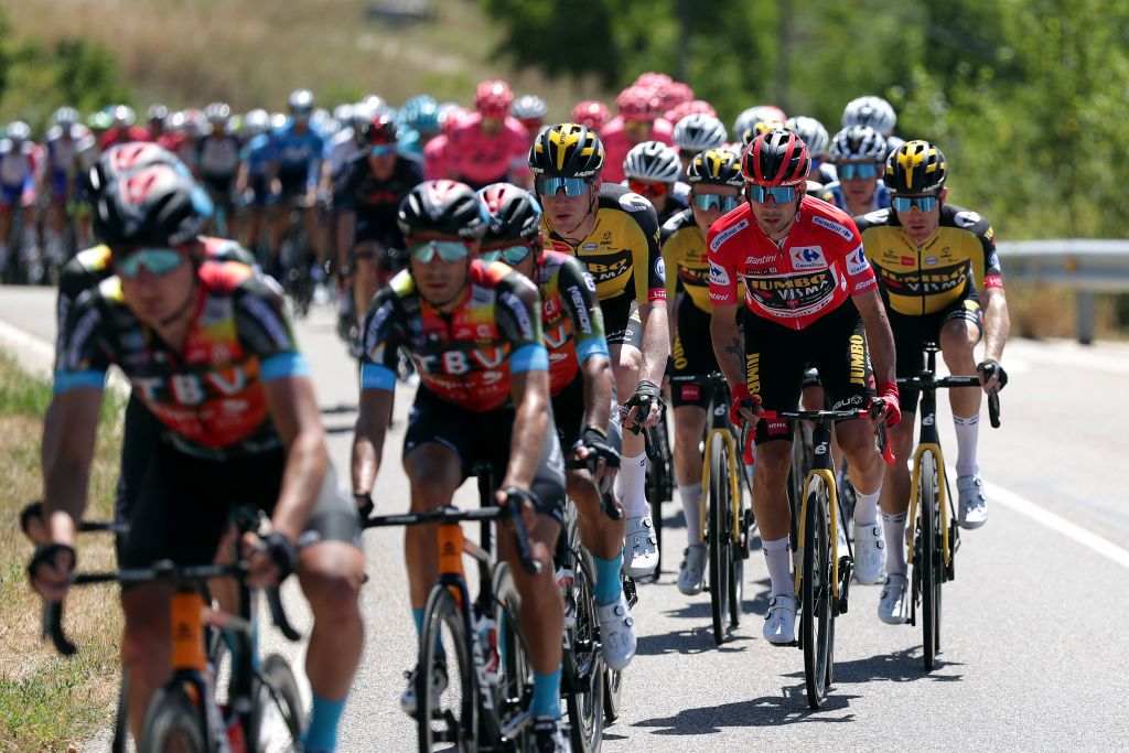 ESPINOSA DE LOS MONTEROS SPAIN AUGUST 16 LR Nathan Van Hooydonck of Belgium Primoz Roglic of Slovenia red leader jersey and Steven Kruijswijk of Netherlands and Team Jumbo Visma compete during the 76th Tour of Spain 2021 Stage 3 a 2028km stage from Santo Domingo de Silos to Espinosa de los Monteros Picn Blanco 1485m lavuelta LaVuelta21 CapitalMundialdelCiclismo on August 16 2021 in Espinosa de los Monteros Spain Photo by Gonzalo Arroyo MorenoGetty Images