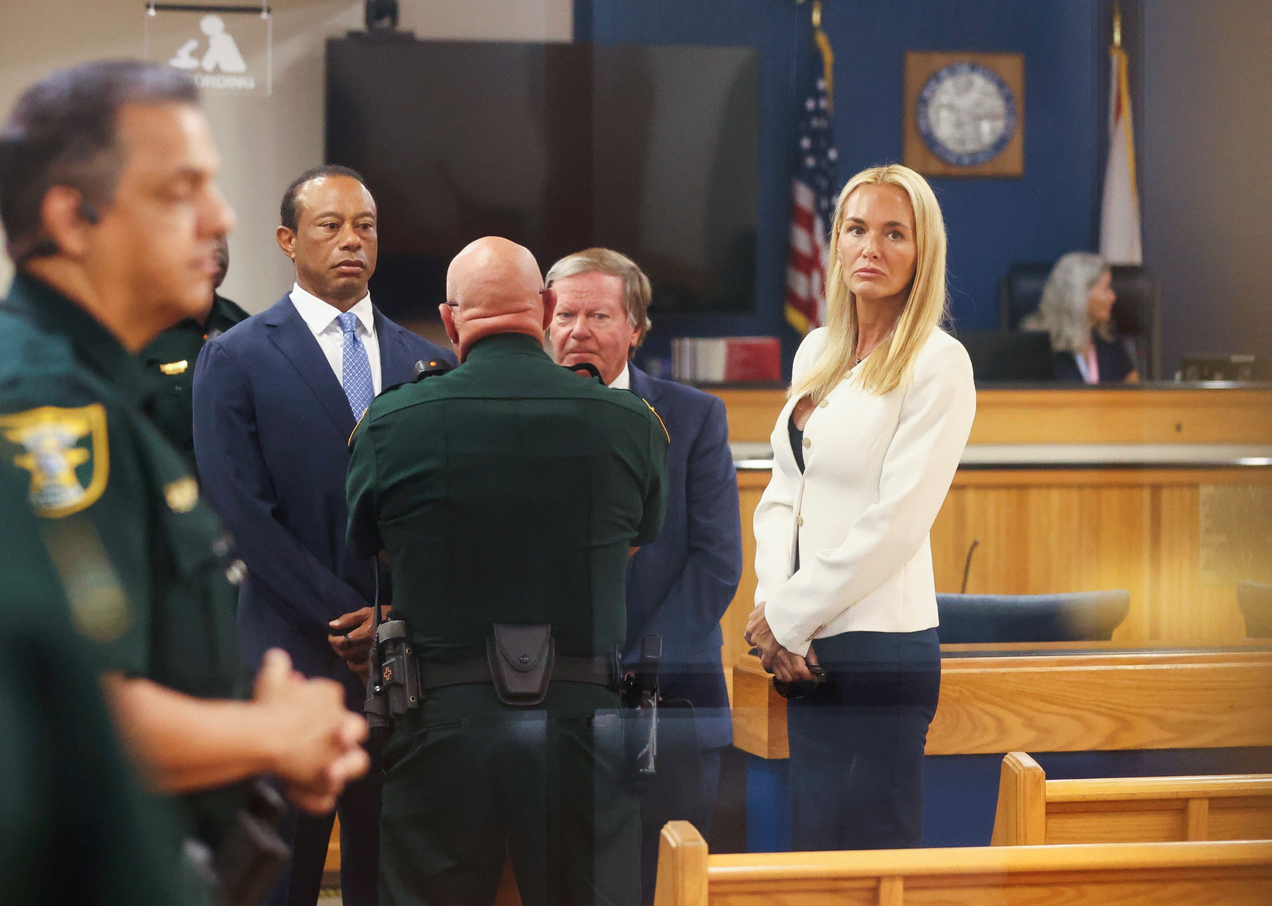 Tiger Woods and Vanessa Trump stand looking on following a court hearing in Martin County Courtroom on September 2, 2026