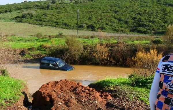 An unlucky motorist was not successful in crossing a swollen stream.