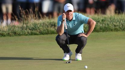 Rory McIlroy lines up a putt on the 18th green during the final round of US Open.