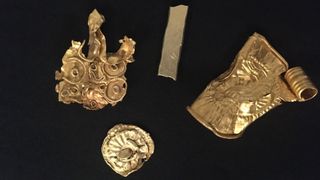 Four golden objects found in the Norfolk hoard