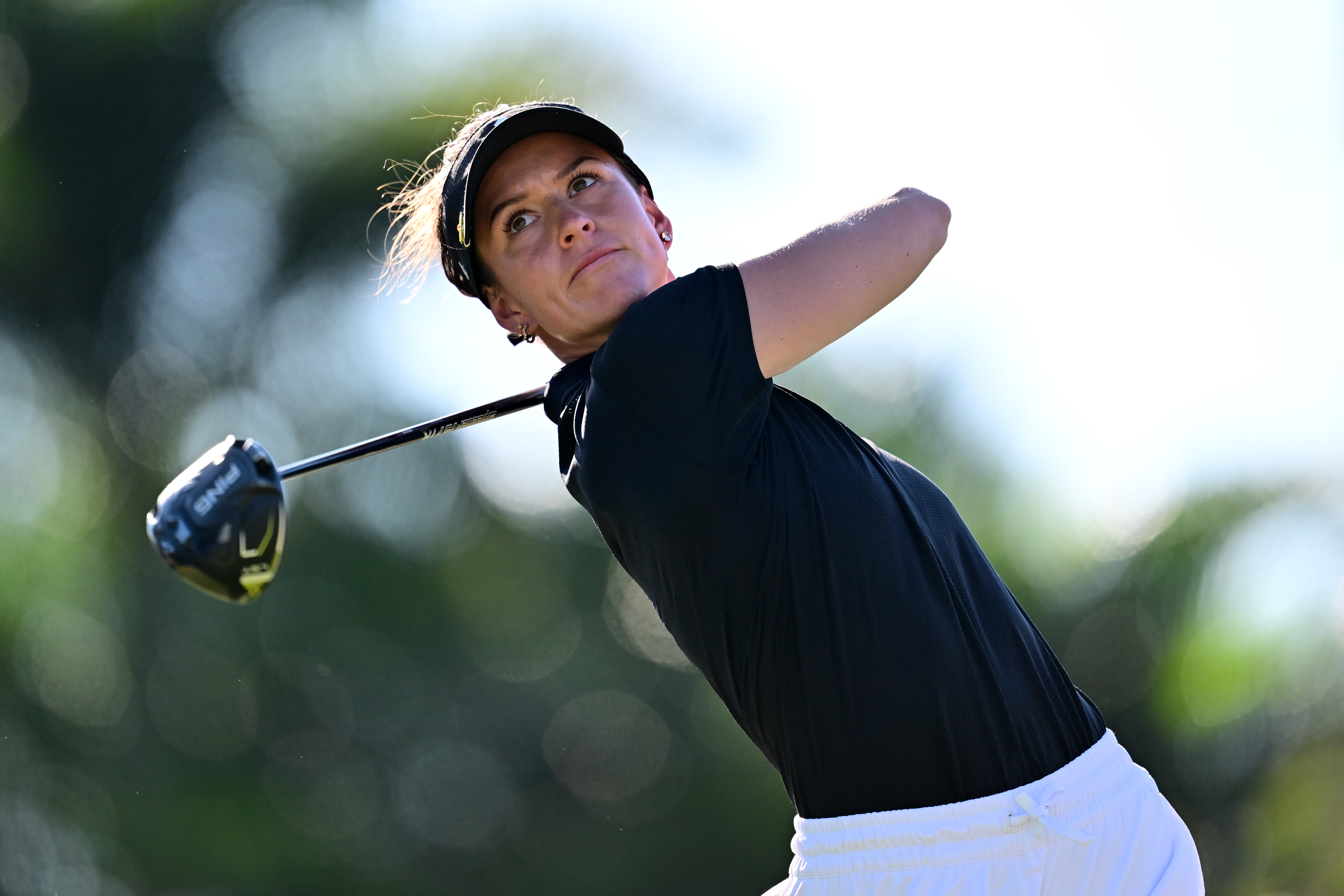 Linn Grant hits a driver and watches its flight