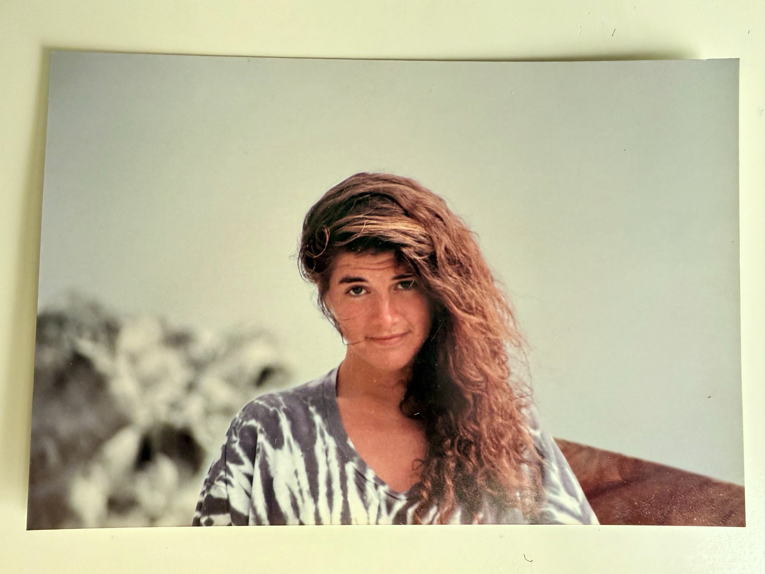 A younger Jill Christman with long dark hair, photographed outdoors.