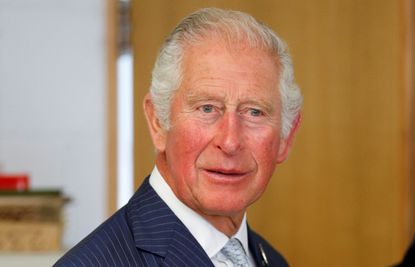 Prince Charles, Prince of Wales looks at products at Jodrell Laboratory at The Royal Botanic Gardens in Kew