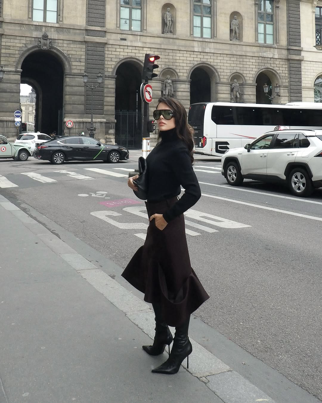 woman wearing black turtleneck outfit fall 2025