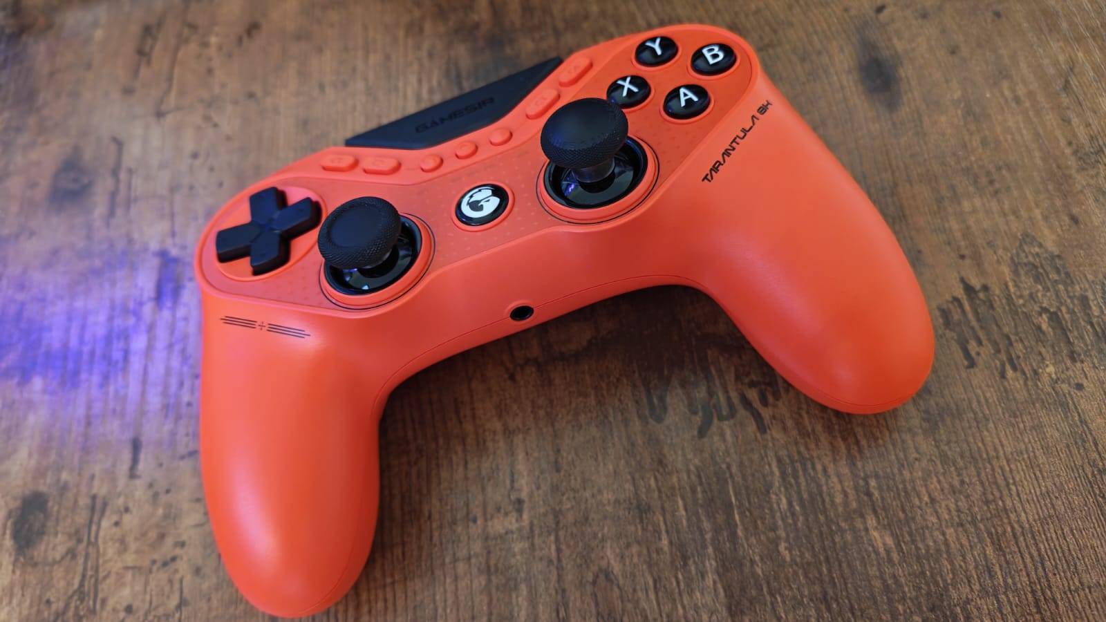 A GameSir Tarantula 8K on a wooden desk surface
