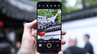 Vivo X300 Pro camera phone held in a hand