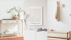 Here are three pictures of white entryways, one of a console table, one of wall art, and one of an entrway bench and hooks