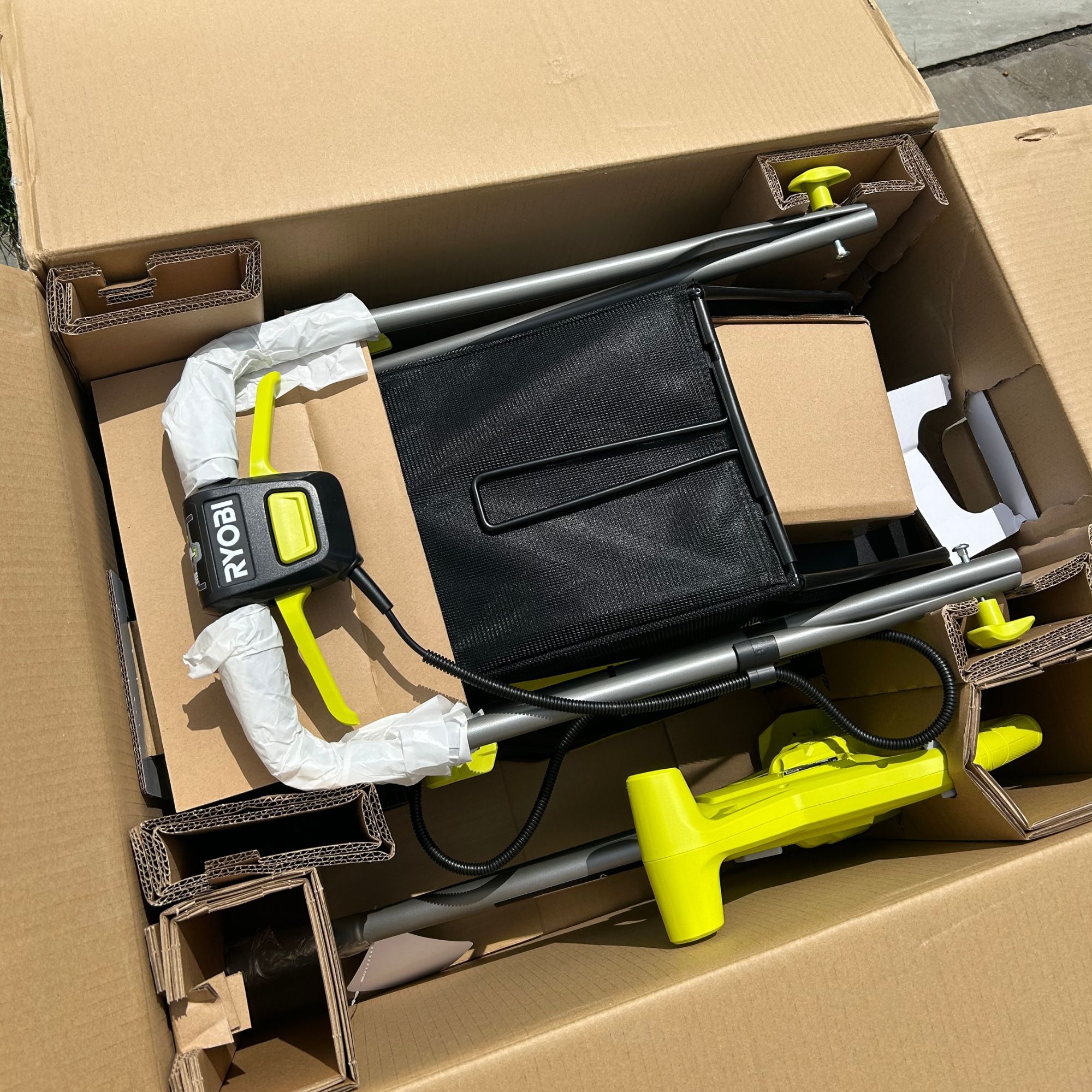 Lawnmower inside box, with packaging