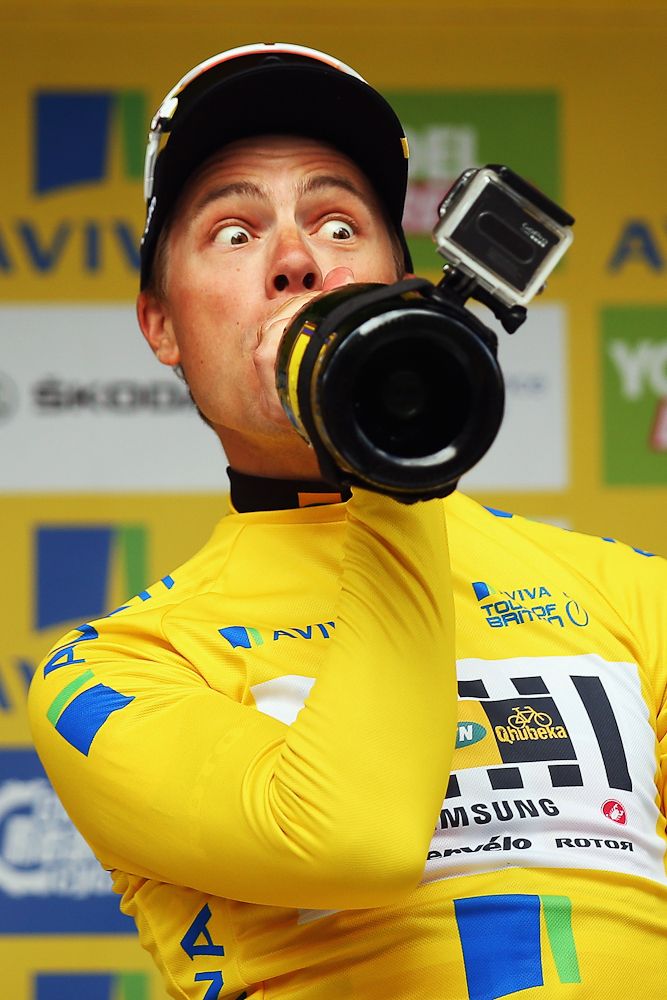 Edvald Boasson Hagen takes a drink on the final podium at the Tour of Britain.