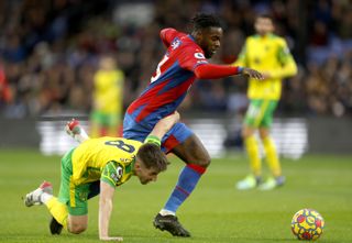 Crystal Palace’s Jeffrey Schlupp (right) and Norwich's Billy Gilmour battle for the ball