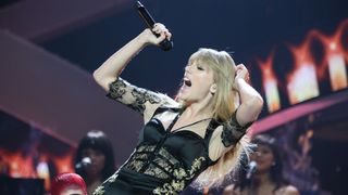 LONDON, ENGLAND - FEBRUARY 20: Taylor Swift performs on stage The BRIT Awards 2013 at The O2, on February 20, 2013 in London, England. (Photo by JM Enternational/Redferns)
