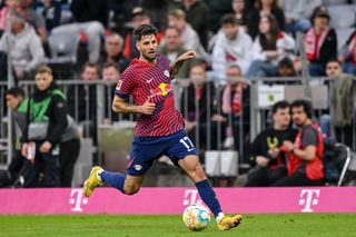 Dominik Szoboszlai of RB Leipzig controls the Ball during the Bundesliga match between FC Bayern München and RB Leipzig at Allianz Arena on May 20, 2023 in Munich, Germany.