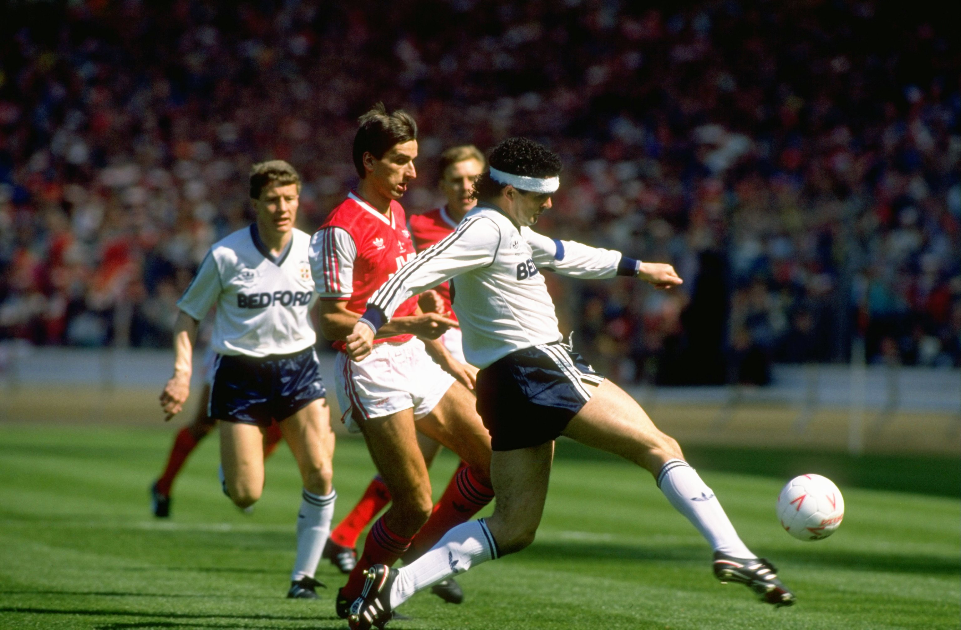 Luton Town's Steve Foster clears the ball in the 1988 League Cup final against Arsenal.