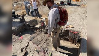 Utah state historic preservation officer Christopher Merritt examines excavated floorboards from a Chinese home in the ghost town of Terrace, Utah. Between two and four Chinese railroad maintenance workers likely lived in this home, which would have been built around 1869. This is the first fully excavated Chinese worker home on the transcontinental railroad line. 