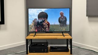 Amazon Fire TV Omni QLED QL43F601 straight on front view on TV stand