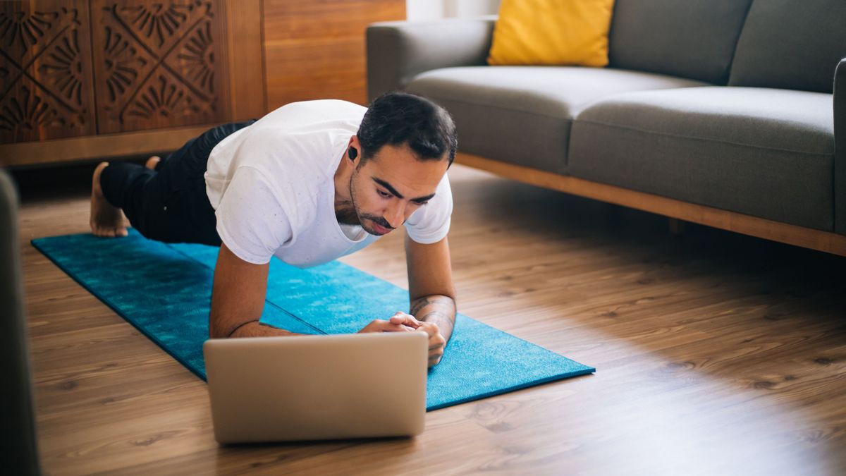 Man at home doing low impact workout to build muscle