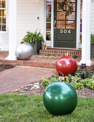giant inflatable baubles in a front yard