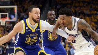Malik Monk #0 of the Sacramento Kings is guarded by Stephen Curry #30 of the Golden State Warriors will face off in the Warriors vs. Kings live stream