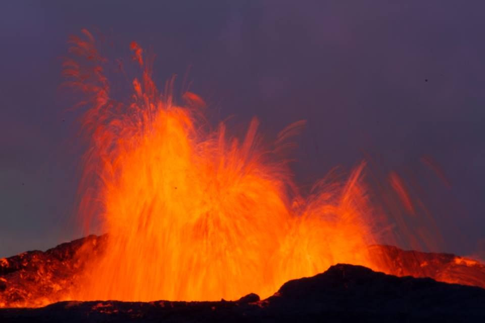 A fire fountain erupts from a crevice in Iceland.