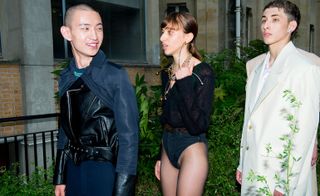 Models wear floral coat and black body at Y/Project S/S 2019