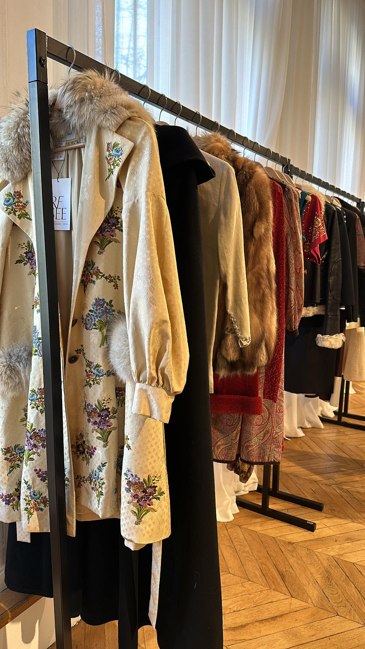 Racks of clothing inside ReSee, one of the best vintage stores in Paris.
