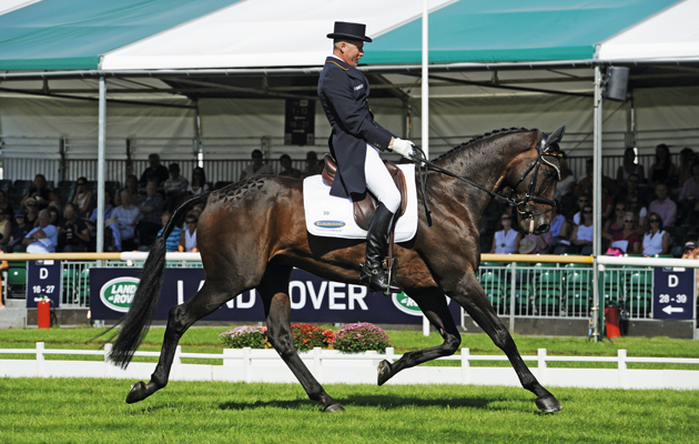 Andreas Dibowski riding FRH Butts Leon during the dressage at Burghley Horse Trials 2013