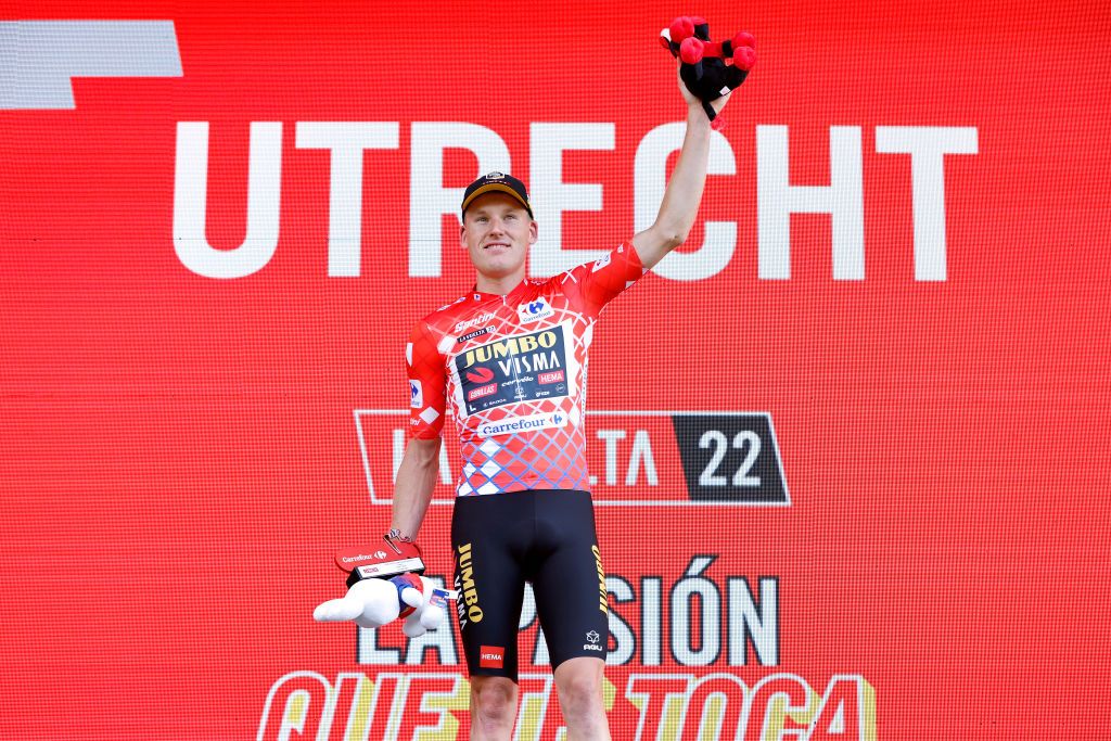 UTRECHT NETHERLANDS AUGUST 20 Mike Teunissen of Netherlands and Team Jumbo Visma celebrates winning the Red Leader Jersey on the podium ceremony after the 77th Tour of Spain 2022 Stage 2 a 1751km stage from sHertogenbosch to Utrecht LaVuelta22 WorldTour on August 20 2022 in Utrecht Netherlands Photo by Bas CzerwinskiGetty Images