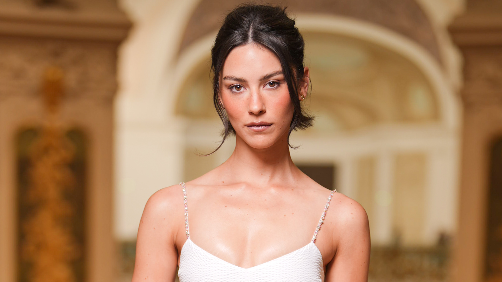 Gracie Abrams attended the Chanel Haute Couture show in a little white dress.