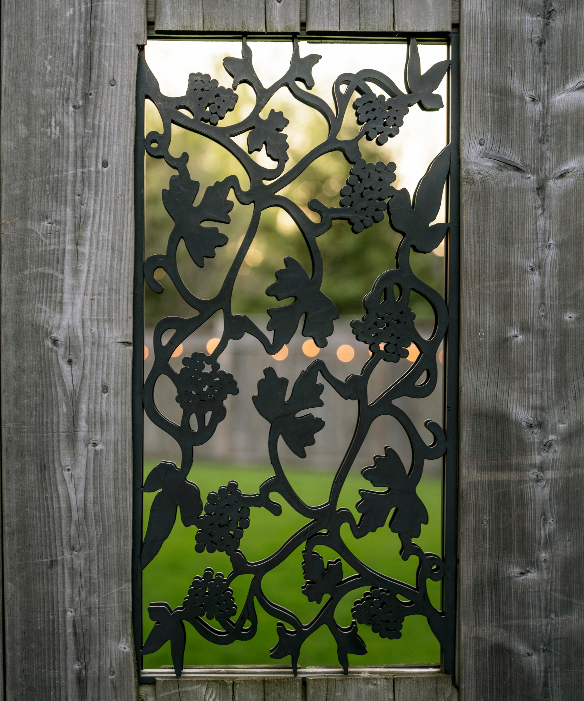 decorative metal panel inset into a fence