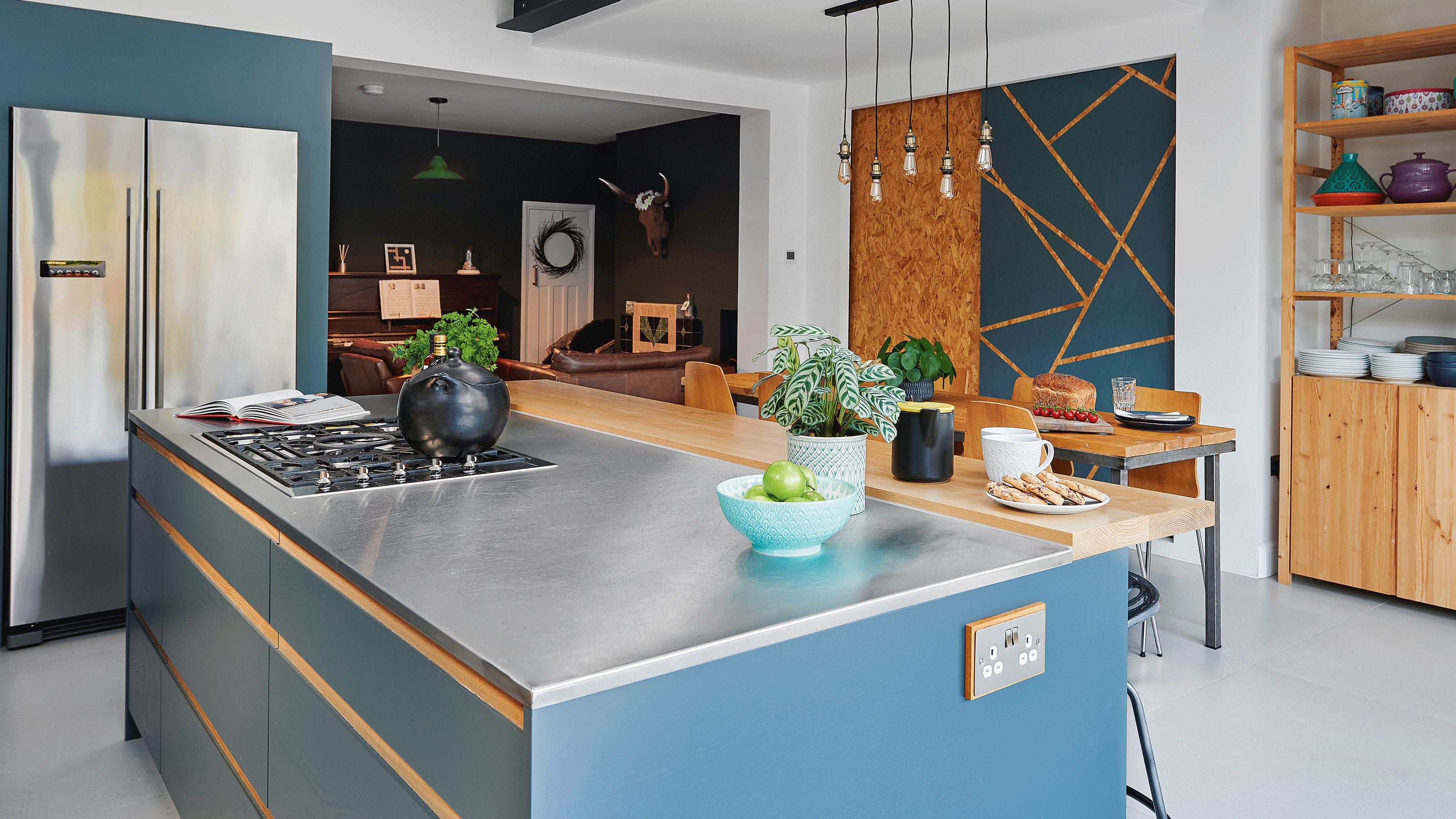 Stainless steel countertop on blue kitchen island