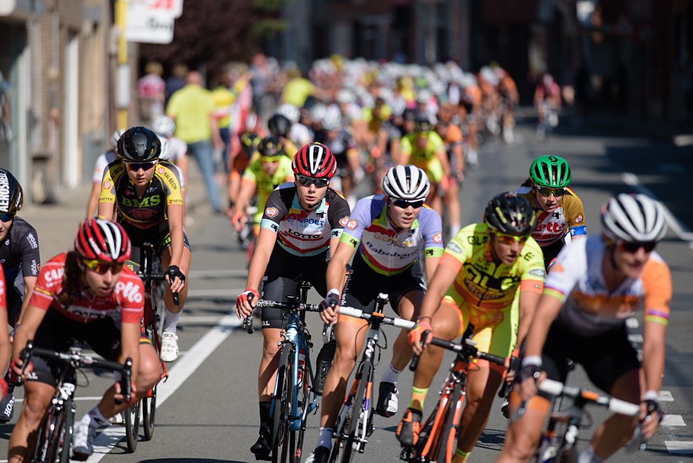 The peloton are almost a minute behind Alexis Ryan (CANYON//SRAM Racing) as they complete the first of six local laps at the 121 km Stage 1 of the Lotto Belgium Tour 2016