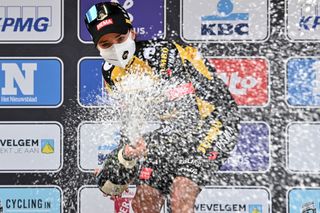 Marianne Vos celebrates on the podium with champagne after winning the womens edition of the GentWevelgem In Flanders Fields 2475 kilometers road cycling race from Ypers to Wevelgem on March 28 2021 Belgium OUT Photo by DAVID STOCKMAN various sources AFP Belgium OUT Photo by DAVID STOCKMANBelgaAFP via Getty Images