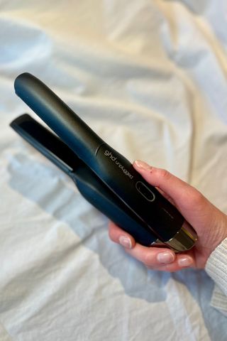 Katie holding ghd Unplugged Cordless Styler