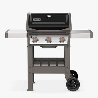 Weber bbq in blakc and stainless steel with large knobs, side panels and wheels.