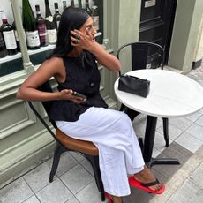 An image of @monikh wearing one of the it sandals of 2025. 