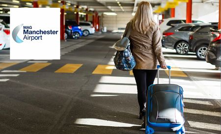 Woman dragging luggage and carrying back at Manchester Airport Parking