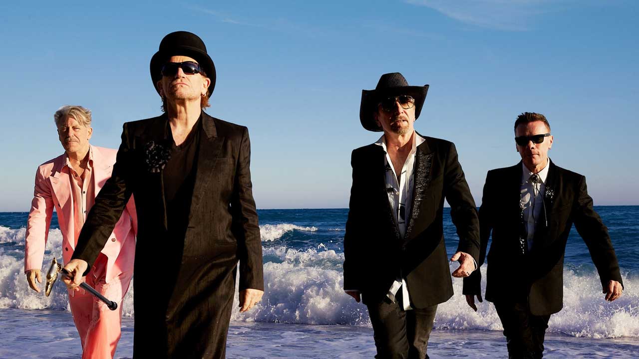 U2 walking out of the sea - group portrait