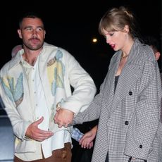 Travis Kelce and Taylor Swift arriving at a Saturday Night Live after party in New York City in October 2023.