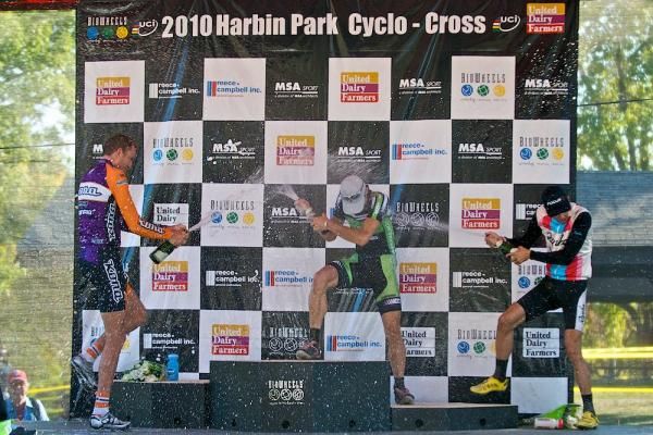 Jeremy Powers won the race but lost the champagne fight on the podium. Ryan Trebon launches a frontal assault while third place Chris Jones attacks the flank.