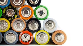neat pile of AA batteries of various colors, as viewed from one end 