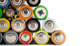 neat pile of AA batteries of various colors, as viewed from one end