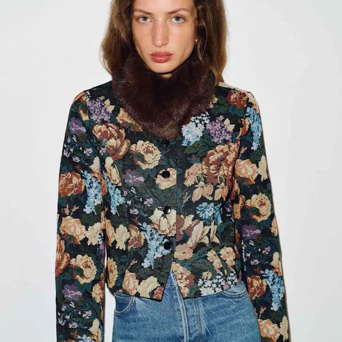 Woman in a floral brocade jacket