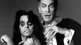 Alice Cooper posing for a photograph with horror actor Vincent Price in 1975