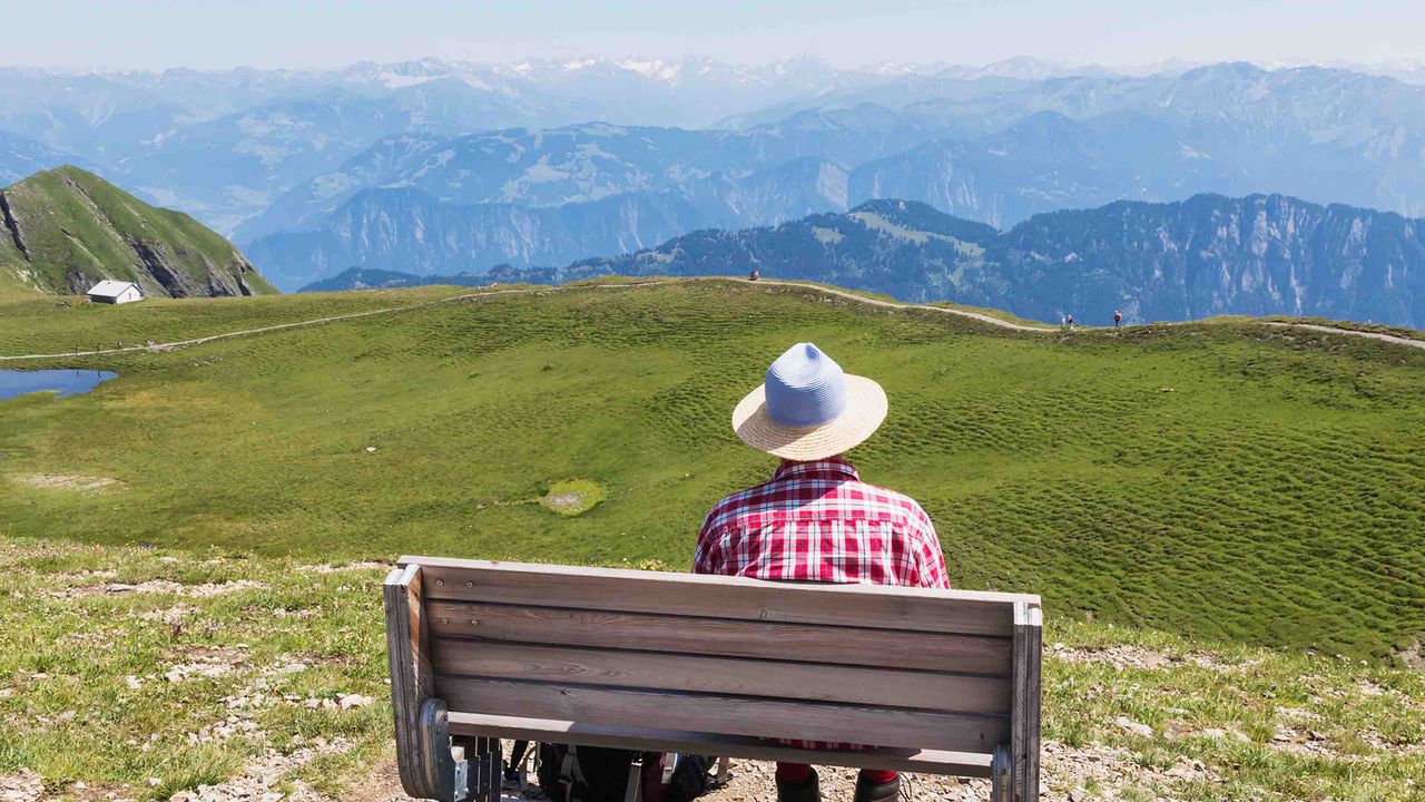 photo of a person sitting on a bench 