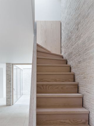 Staircase leading to the upper level of london garage conversion