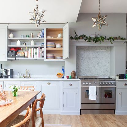 Pale blue kitchen with star pendants 